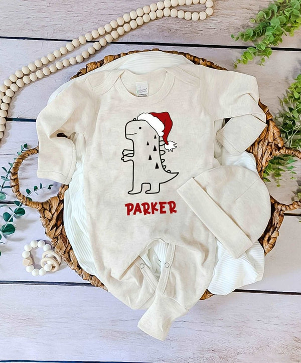 Personalized Christmas Neutral Baby Romper with Bow or Hat | Oatmeal Romper Cute T-Rex Dinosaur Baby Name | Infant Christmas Outfit - BabiChic