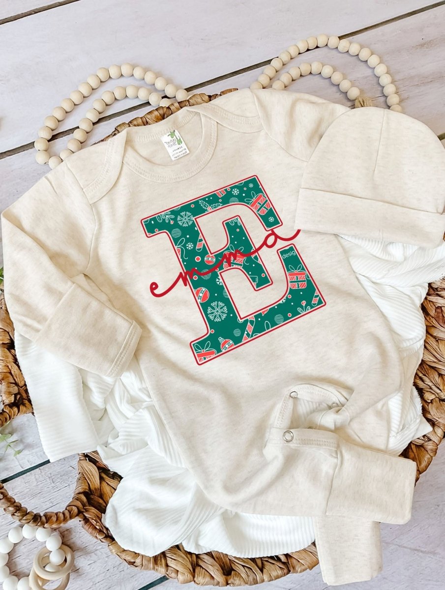 Pesonalized Christmas Neutral Baby Romper with Bow or Hat | Oatmeal Romper with Blue and Red Christmas Print Initial Baby Name | Newborn Xmas Outfit - BabiChic