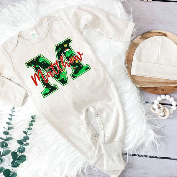 Pesonalized Christmas Neutral Baby Romper with Bow or Hat | Oatmeal Romper with Blue Dinosaur Christmas Print Initial Baby Name | Newborn Xmas Outfit - BabiChic