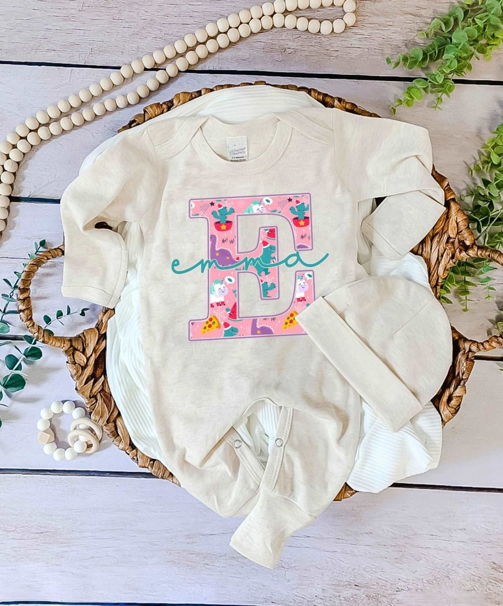 Pesonalized Christmas Neutral Baby Romper with Bow or Hat | Oatmeal Romper with Blue Dinosaur Christmas Print Initial Baby Name | Newborn Xmas Outfit - BabiChic